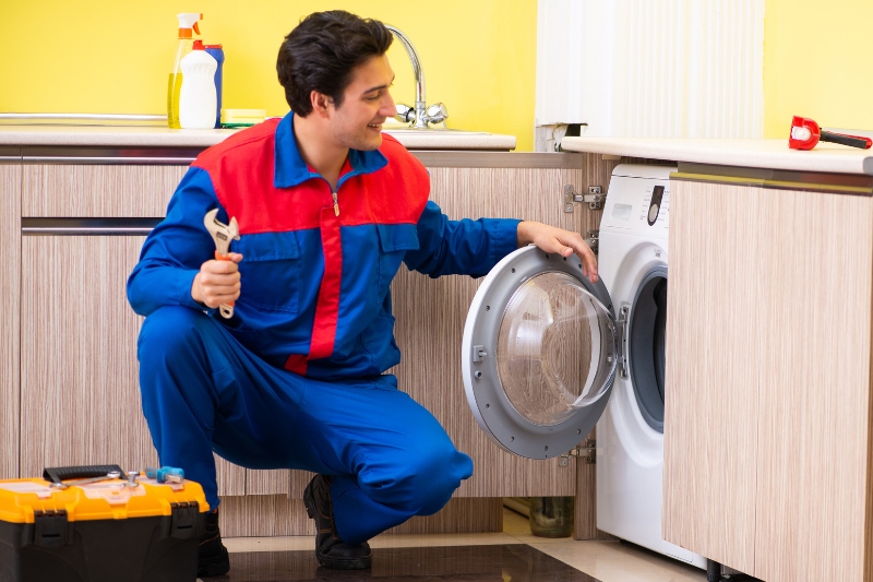 man Installing an Integrated Washing Machine