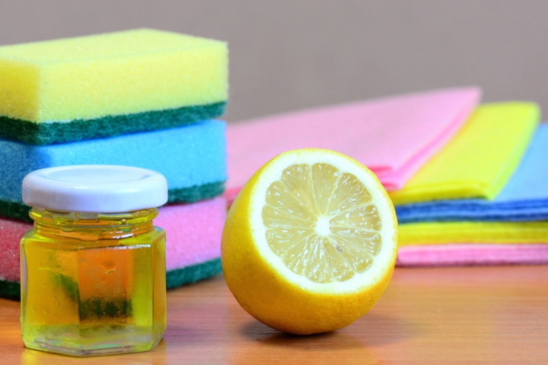 olive oil, lemon, sponge and cloth