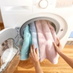 putting towels in the washing machine