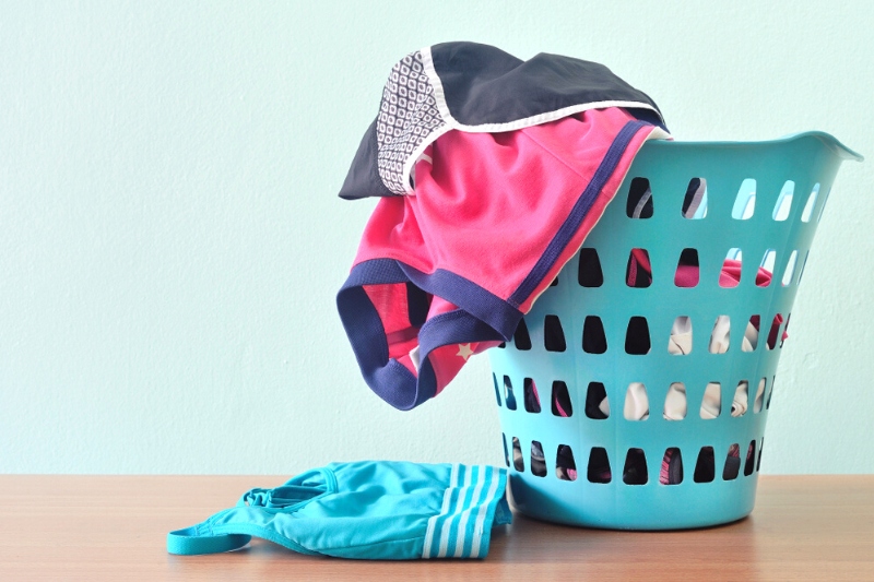 sports clothes in laundry basket