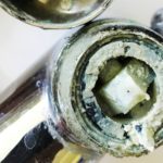 thick limescale on faucet