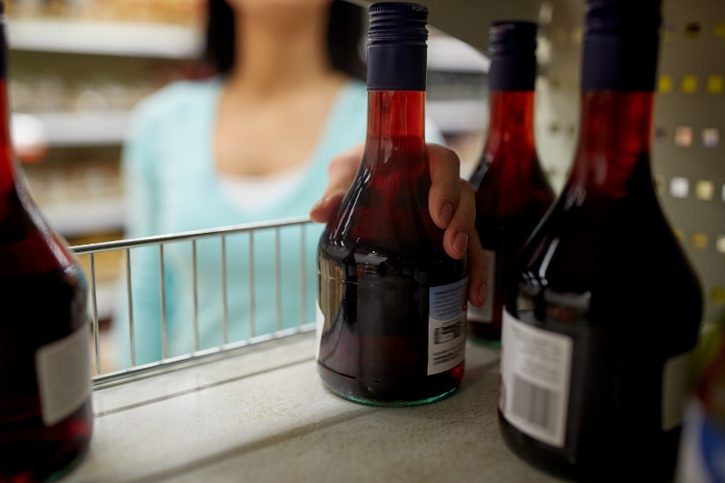 woman buying vinegar