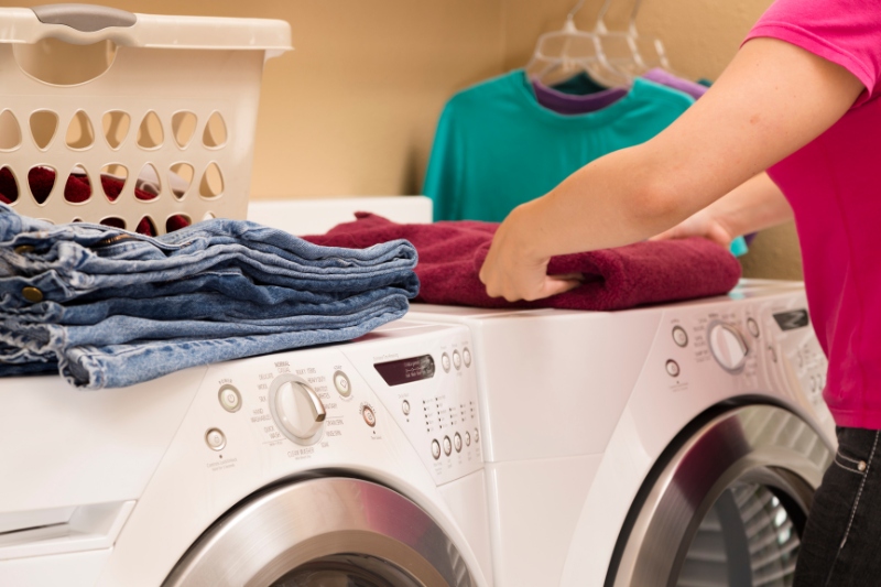 woman folding laundry