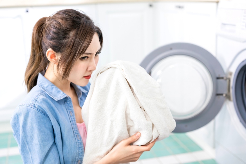 woman smelling laundry