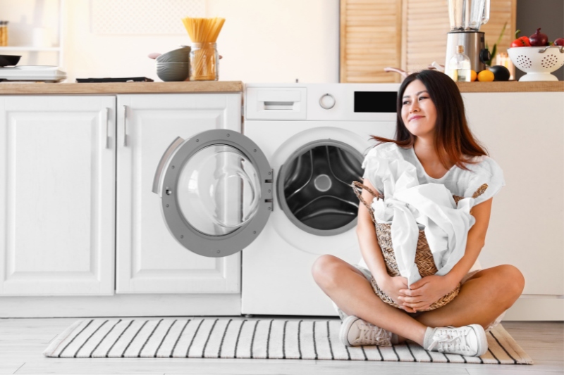 woman in the kitchen with washing machine