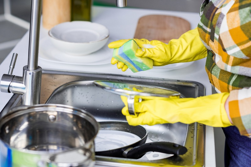 Washing dishes in sink