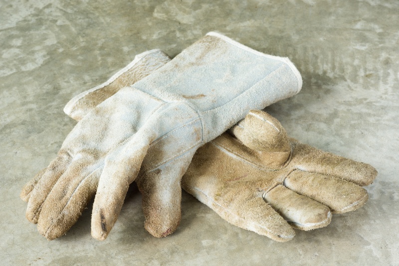 dirty white leather work gloves