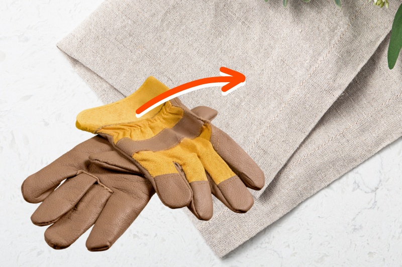 drying leather gloves with towel