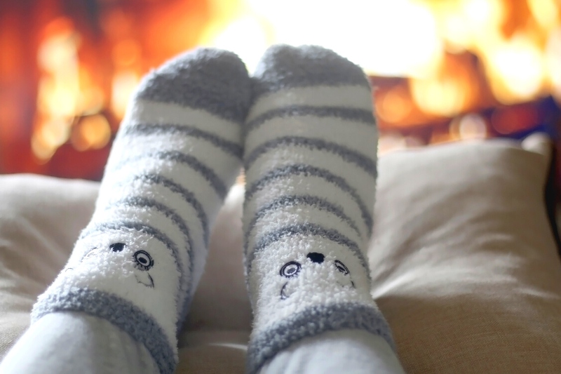 feet wearing fuzzy socks