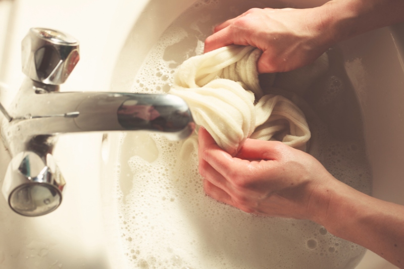 handwashing socks in the sink