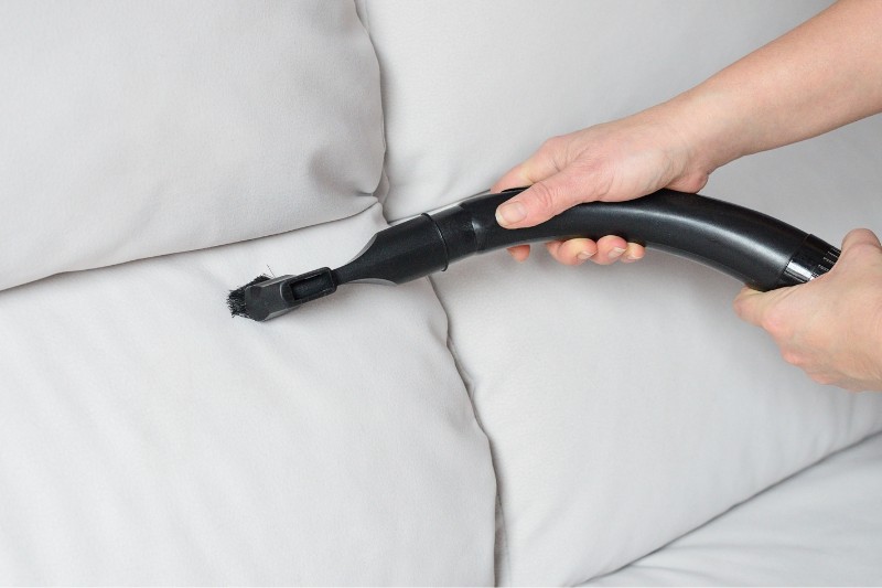 vacuuming sofa