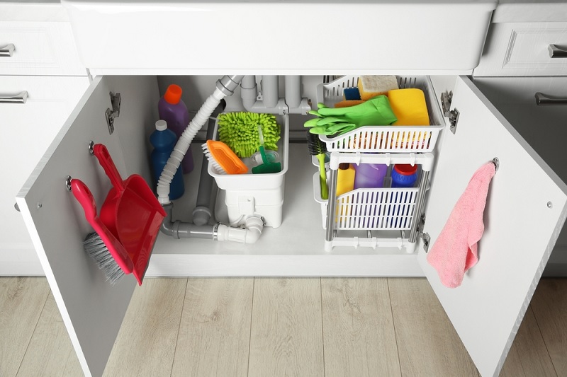 Cleaning products stored in cupboard