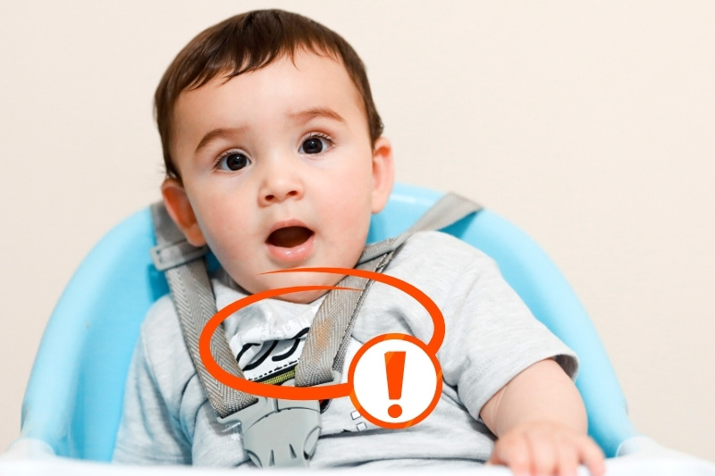 baby boy on a high chair with food stain