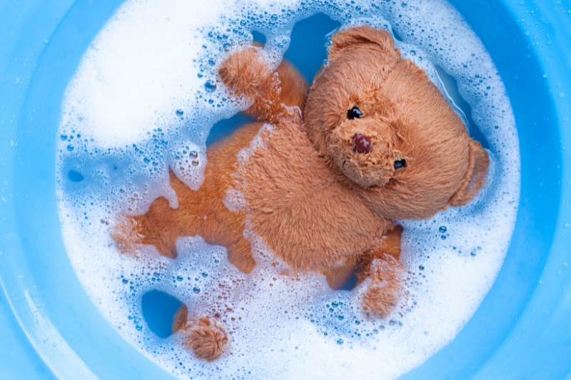 bear stuffed toy in tub