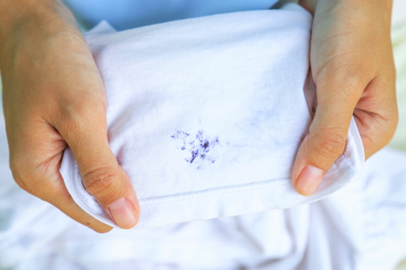 blue stains on white shirt