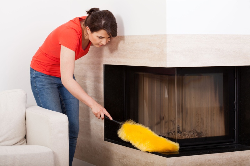 clean marble fireplace with feather duster