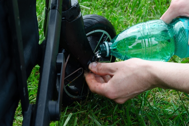 cleaning pram wheels with water