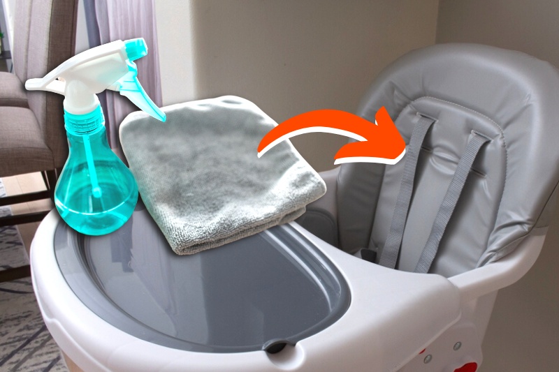 high chair, spray bottle and cleaning cloth