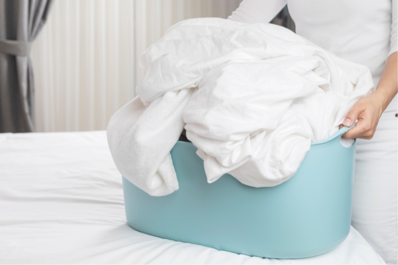 sheets in laundry basket