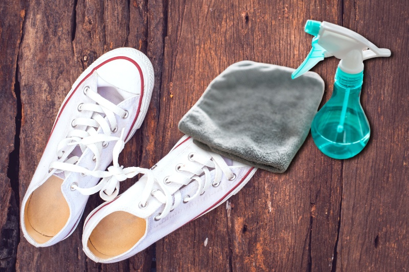 white converse, cloth and bottle spray