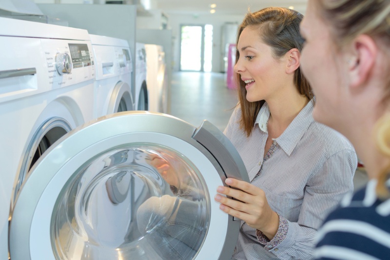 woman buying tumble dryer