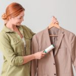 woman cleaning suit