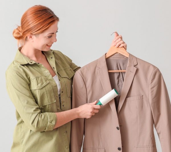 woman cleaning suit