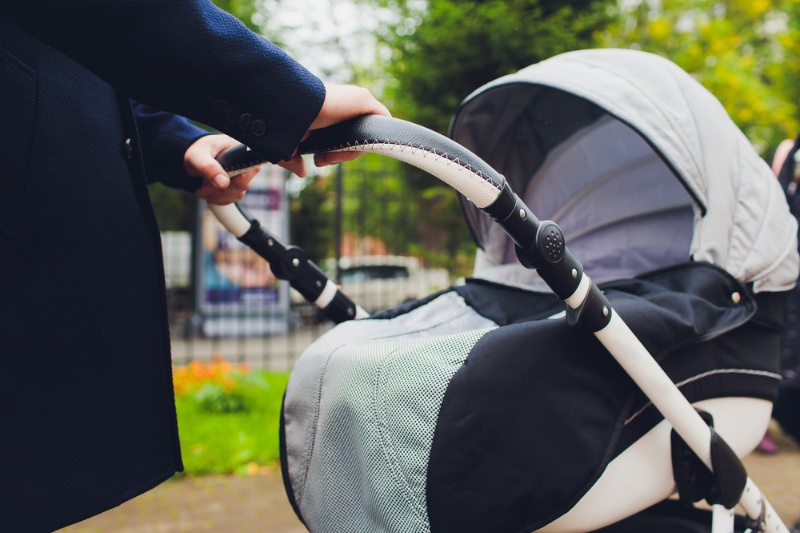 woman holding pram