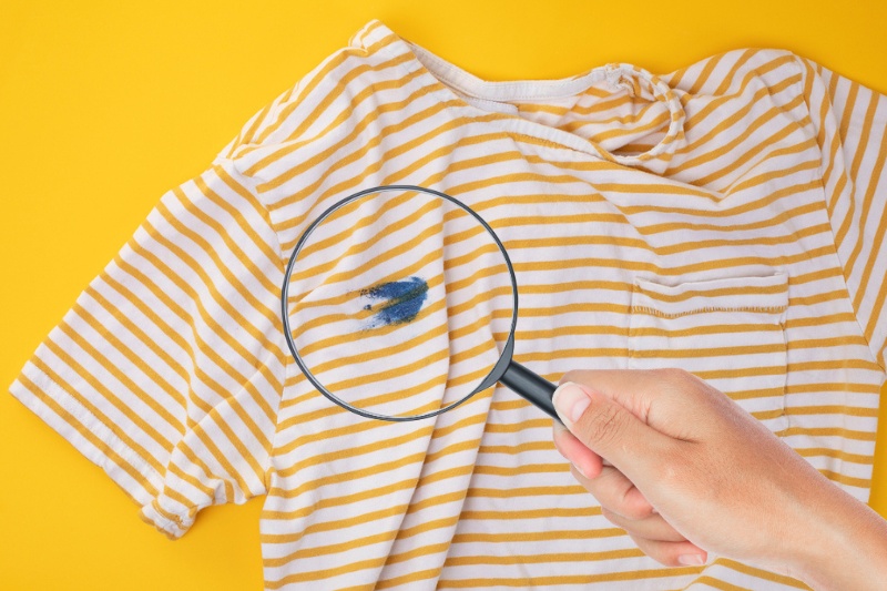 yellow striped shirt with blue stain