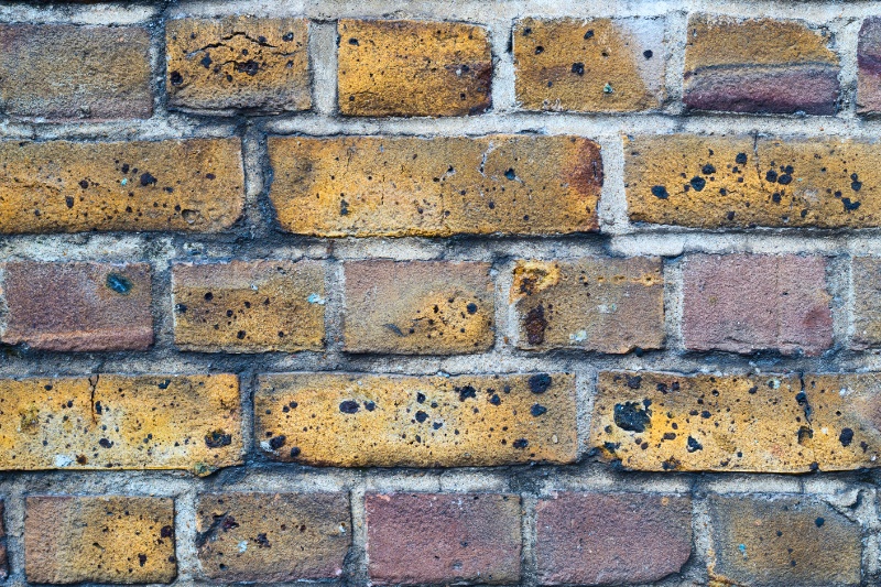 brick wall with black soot