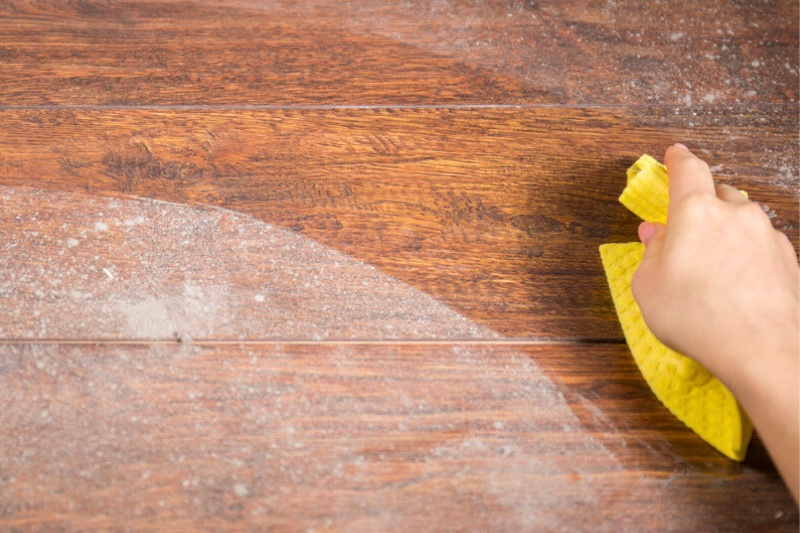 dusting wooden table