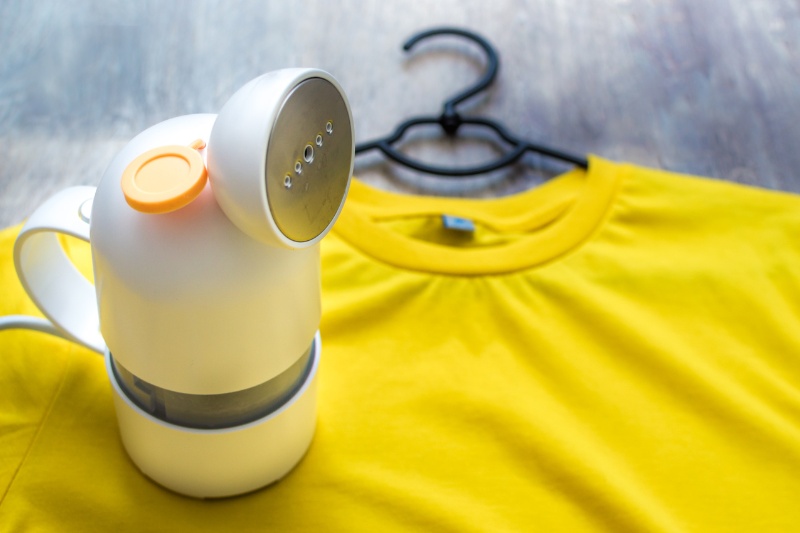 garment steamer and yellow shirt