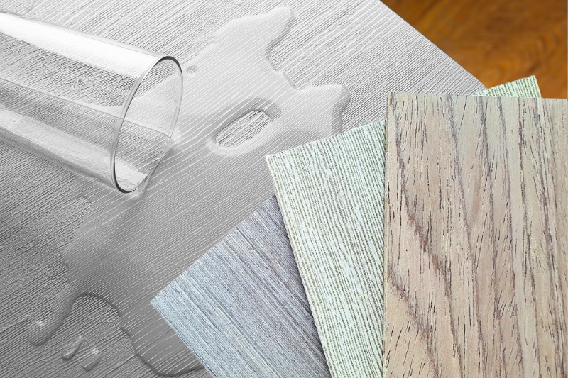 water spilled on table and wood veneer samples
