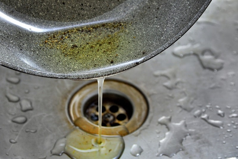 Pouring cooking oil down the sink