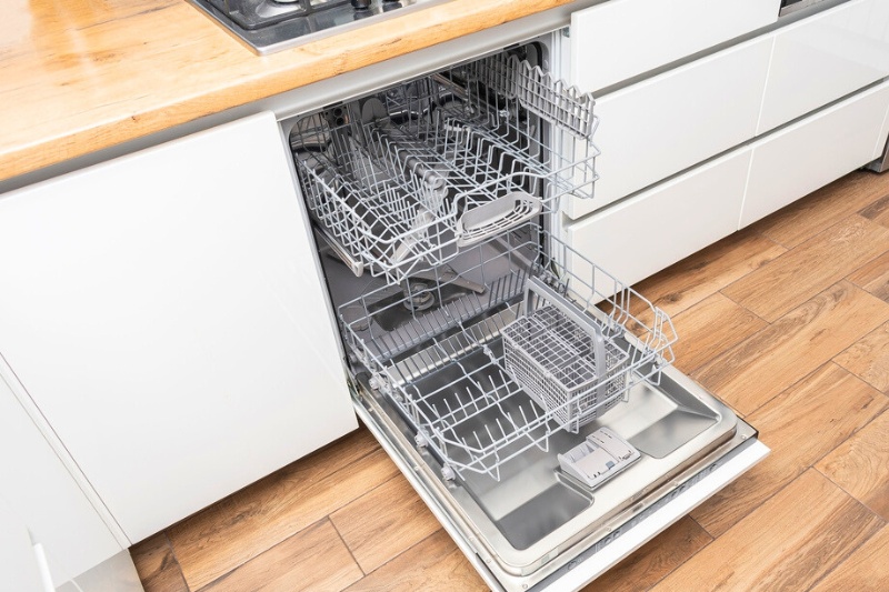 an open and empty dishwasher