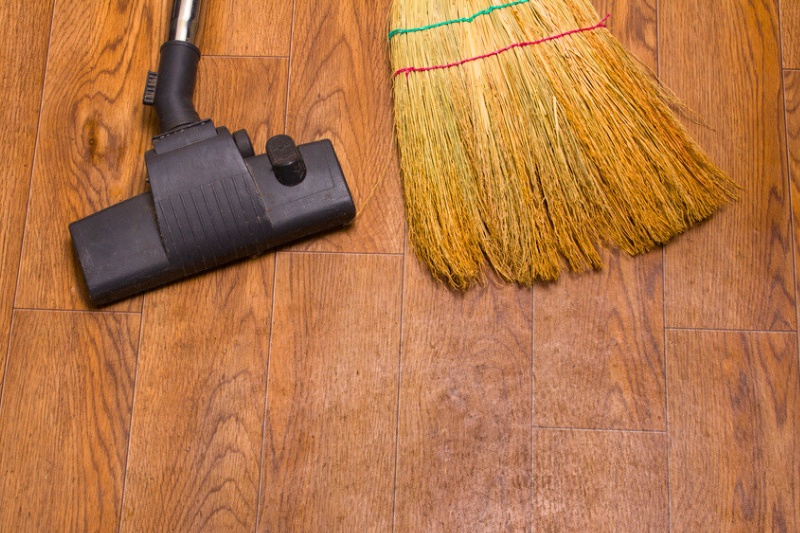 broom and vacuum on floor