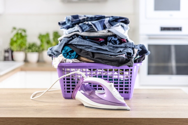 iron and laundry on top of kitchen countertop