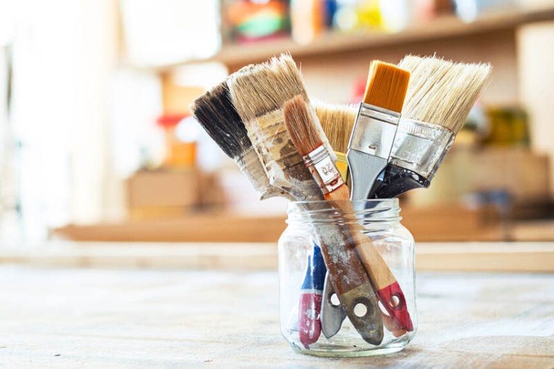paint brushes in bottle