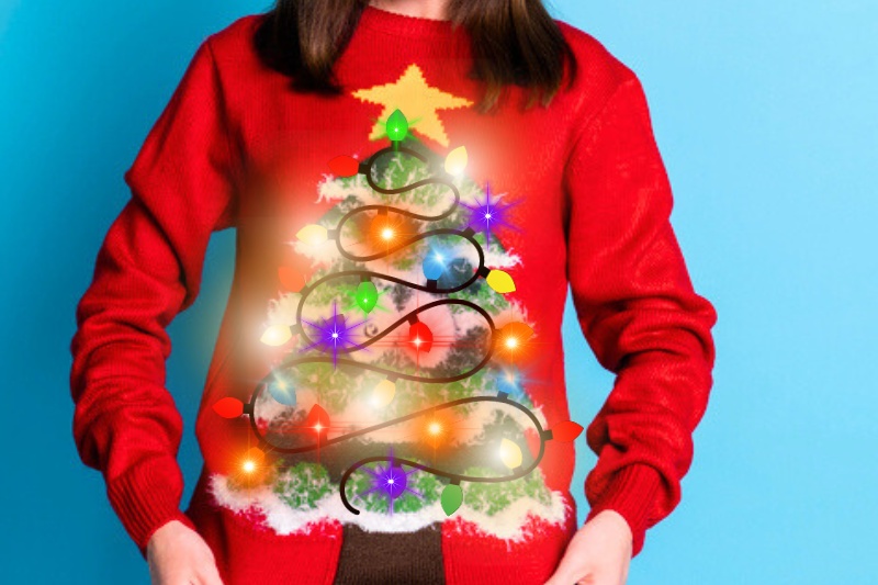 woman wearing red Christmas jumper with lights