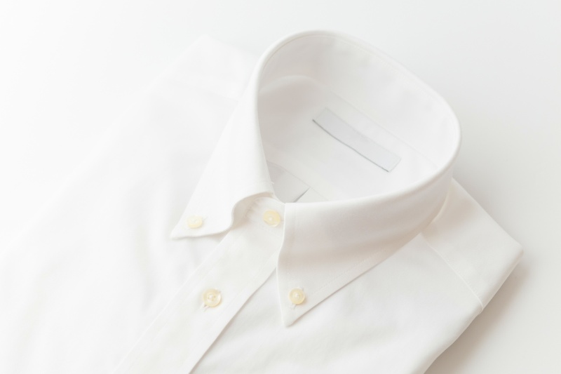 clean and folded white polo shirt
