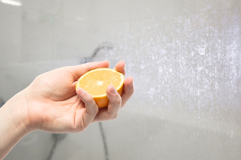 clean shower door with lemon