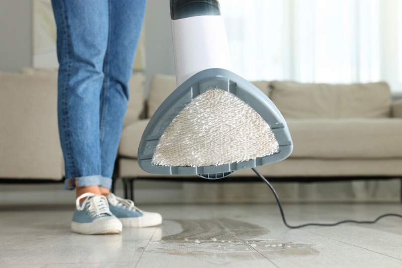 cleaning floor with steam mop