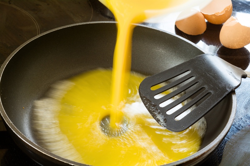 cooking egg on pan