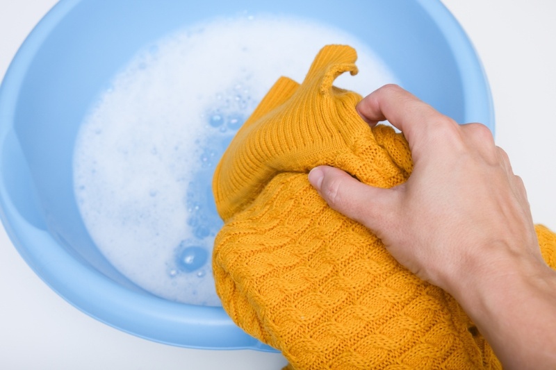 handwashing yellow sweater