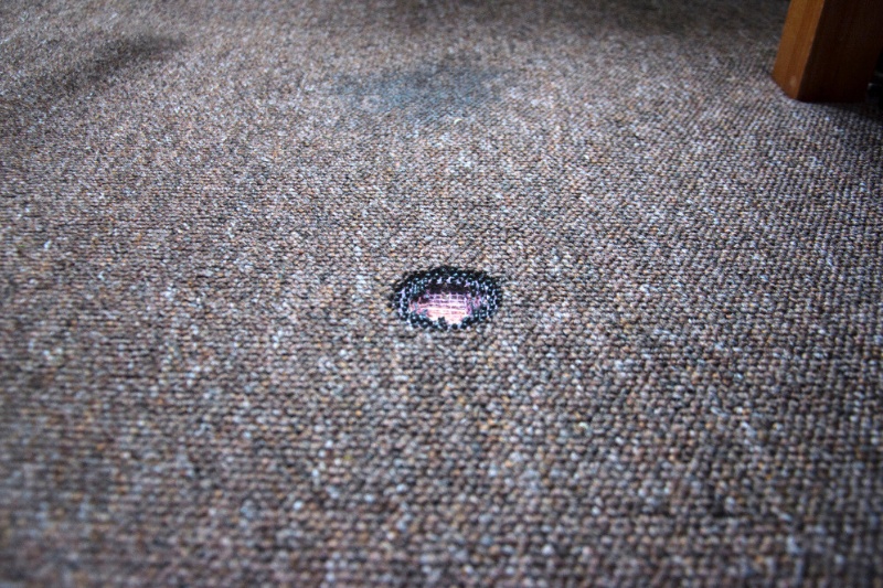 large burn mark on carpet