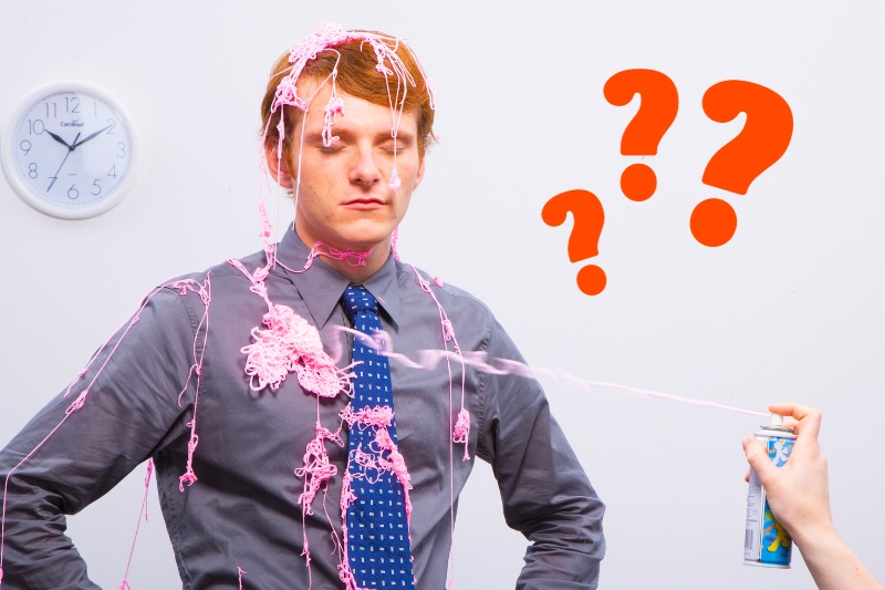 man filled with silly string on clothes