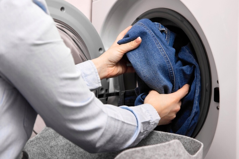 putting denim jacket in the washing machine