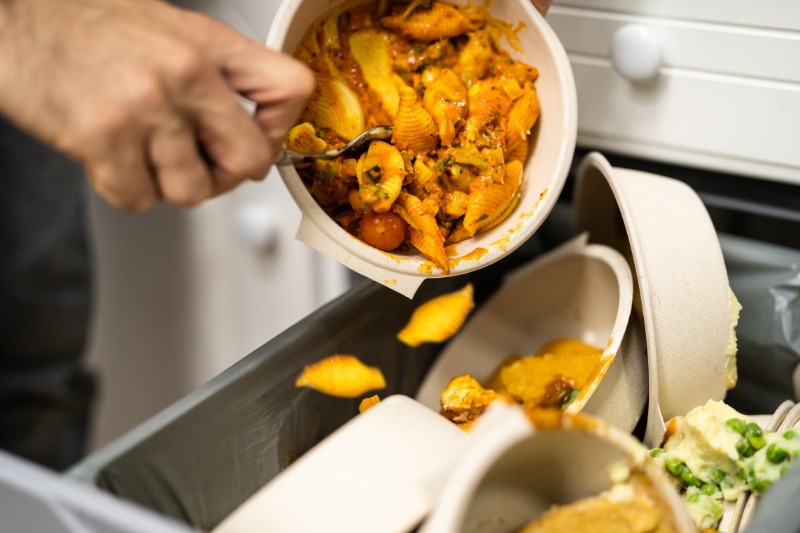 throwing leftover food in the bin