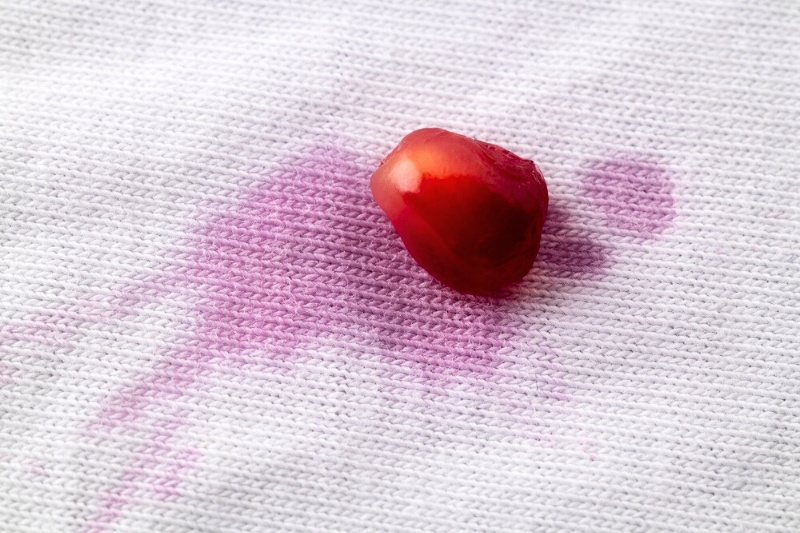 white fabric with pomegranate juice stain