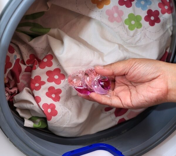 Putting laundry pods in washing machine